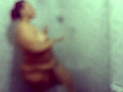 Mature lady with a big ass enjoys a shower