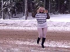 Blonde MILF shows off her assets in the snow