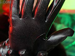 Redhead goddess Arya indulges in her leather gloves fetish